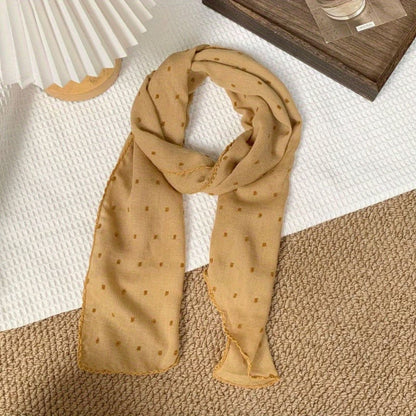 Polka-dot silk scarf—a stylish and versatile small square scarf.